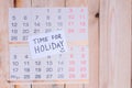 Time For Holiday written on paper note on a wall calendar Royalty Free Stock Photo