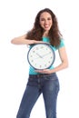 Time keeping beautiful young woman holding clock Royalty Free Stock Photo