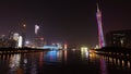 Time laps. View of the embankment at night Guangzhou. Buildings are glowing, a pleasure boat is sailing along the river.