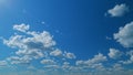 Blue sky white puffy fluffy clouds billow in high space. Sky with clouds weather. Time lapse.