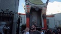 Time lapse of busy pedestrians walking outside TCL Chinese Theatre, in Hollywood