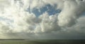 Time Lapse - Clouds obscuring sky and shadowing the sea and the shore at the evening. 4K footage timelapse.