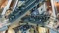 Time lapse of crowd of people in shopping mall. Escalators in modern shopping mall.