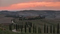 Time lapse of the estate Agriturismo Podere Baccoleno during sunset, with Tuscany trees and road, Italy