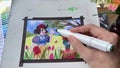 Time lapse of female artist drawing a fairy-tale illustration using alcohol markers. Snowwhite and dwarf on a tulip