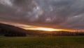 Time-lapse footage of sunset near Grafenau in the Bavarian Forest with clouds and sunbeams, Germany