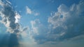 Rays of sun through clouds. Blue sky with cloudscape backlit bright sunlight through summer. Time lapse. Royalty Free Stock Photo