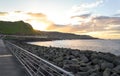 Time lapse of seashore at sunset. Seascape with sun rising while clouds pass by and waves crash in the sand Royalty Free Stock Photo