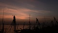 Time lapse of Sunset at sea with fisherman boat silhouttes