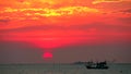 Time lapse of sunset on sea and silhouete cloud move pass