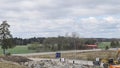 Time lapse view of construction imploding works on rocky terrain.