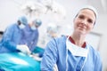 Time is life, not money in this business. Angled portrait of a mature female surgeon wearing hospital scrubs with her Royalty Free Stock Photo