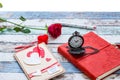 Time for love: red rose, heart, and journal with pocket watch Royalty Free Stock Photo