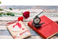 Time for love: red rose, heart, and journal with pocket watch in Royalty Free Stock Photo