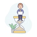 Time Management Concept. Businessman Is Sitting On The Hourglass And Working On The Laptop. Concept Of Working Time Royalty Free Stock Photo