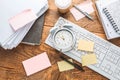 Time management concept. Composition with alarm clock on wooden table with laptop computer, stationary and post-it notes Royalty Free Stock Photo