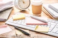 Time management concept. Composition with alarm clock on wooden table with laptop computer, stationary and post-it notes Royalty Free Stock Photo