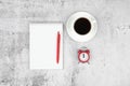 Time management concept. To-do list: red alarm clock, pencil and notebook Royalty Free Stock Photo