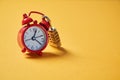 Time management, deadline and urgency concept. Time passing or running out. Clock on the lock, on a yellow background Royalty Free Stock Photo