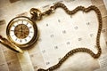 Time management, pocket watch on calendar Royalty Free Stock Photo