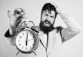 Time management skills. How much time left till deadline. Time to work. Man bearded stressful businessman hold clock Royalty Free Stock Photo