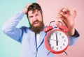 Time management skills. How much time left till deadline. Time to work. Man bearded stressful businessman hold clock Royalty Free Stock Photo