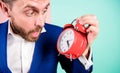 Time management skills. How much time left till deadline. Time to work. Man bearded surprised businessman hold clock Royalty Free Stock Photo