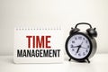time management words with calculator and clock with notebook Royalty Free Stock Photo