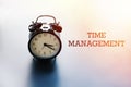 Time management, work life balance concept, alarm clock with words TIME MANAGEMENT Royalty Free Stock Photo