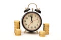Time is Money concept with Coins stack around clock