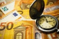 Time is money concept with euros banknotes