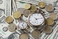 Time is money finance concept with old vintage clocks, dollar bills and euro coins Royalty Free Stock Photo