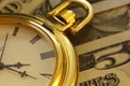 Time and Money. Gold Tone. Close up - Stock Image