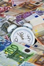 Time is Money with clock and Euro Bank notes Royalty Free Stock Photo