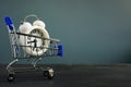 Time is money. Shopping cart with watch or alarm clock and copy space Royalty Free Stock Photo