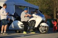 Man sitting on white motorcycle Victory Vision Tour on a sunny evening Royalty Free Stock Photo