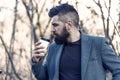 Time for myself. Hipster hold paper coffee cup. Relaxing coffee break. Businessman bearded guy drink coffee outdoors Royalty Free Stock Photo