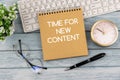 Time for new content text on notepad Royalty Free Stock Photo