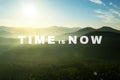 Time Is Now. Motivational quote inspiring to not delay life and take real actions today. Text against beautiful mountain landscape Royalty Free Stock Photo