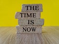 The time is now - words from brick blocks with letters, the time is now concept, Royalty Free Stock Photo