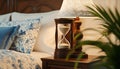 Time passes in a rustic room with an antique hourglass and flowing sand Royalty Free Stock Photo