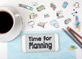 Time for planning. Mobile phone and coffee cup on a white office desk Royalty Free Stock Photo