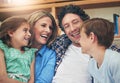 Time is precious - Spend it with those precious to you. a happy family relaxing on the sofa together at home. Royalty Free Stock Photo