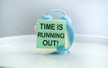 Time is running out is shown using the text and alarm clock. Royalty Free Stock Photo