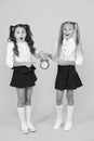 It is time. School schedule. Schoolgirls and alarm clock. Children school pupils. Knowledge day. School time. Surprised Royalty Free Stock Photo