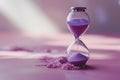 Time slipping away: an hourglass with purple sand against a pink backdrop