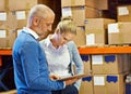 Time for a stocktake. two people doing an inventory check in a warehouse. Royalty Free Stock Photo