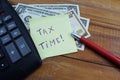 Time taxes, on the table is a calculator and money dollars Royalty Free Stock Photo