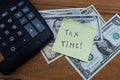 Time taxes, on the table is a calculator and money dollars Royalty Free Stock Photo