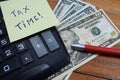 Time taxes, on the table is a calculator and money dollars Royalty Free Stock Photo